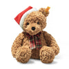 Steiff Jimmy Christmas Teddy Bear wearing festive holiday outfit, collectible plush gift.