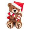 Teddy Hermann Christmas teddy bear wearing a festive hat and holding a candy cane.