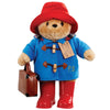 Large Paddington Bear plush in blue coat, red hat, brown boots, holding briefcase