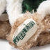 Close-up of Steiff Noel Bear playing Silent Night from internal music box, dressed in festive holiday outfit
