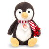 Teddy Hermann Penguin Pancho plush toy with soft fur and red striped scarf, handmade and perfect as a gift for babies, christenings, or playtime.